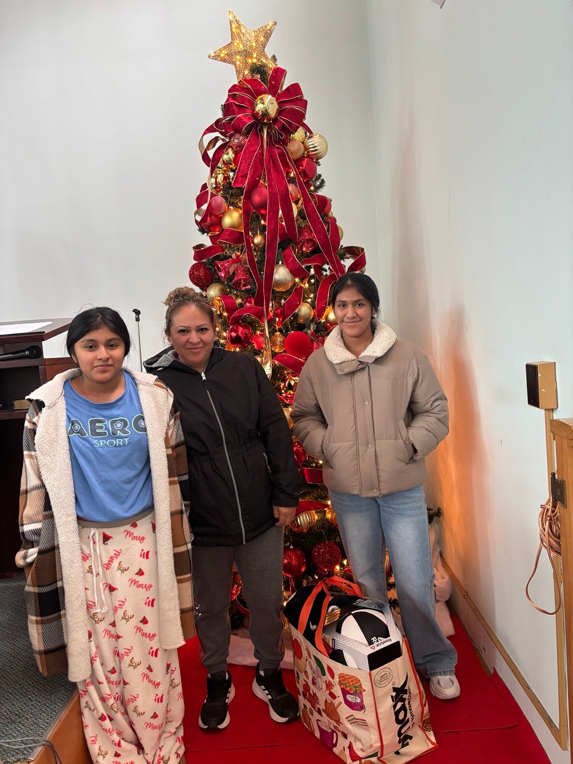Gathering by the Christmas tree