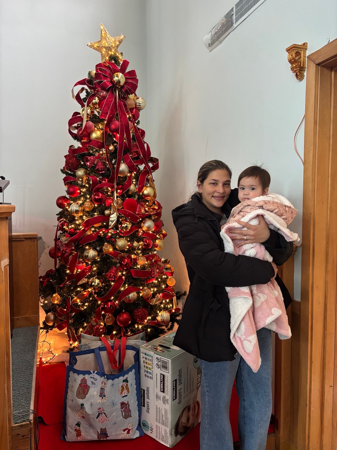 A Christmas moment beside the tree